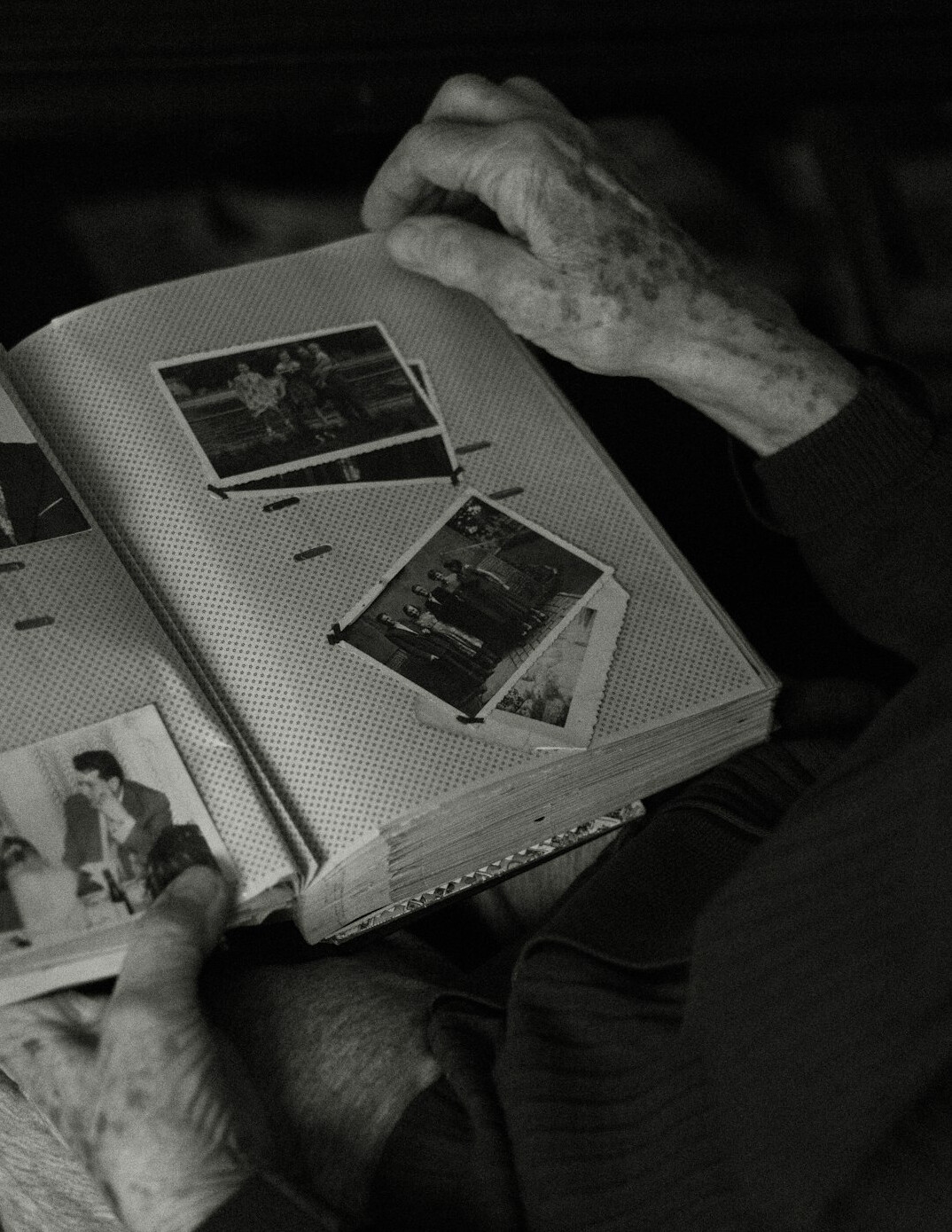 Team of Polish photo editors reviewing contact sheets in an editing room