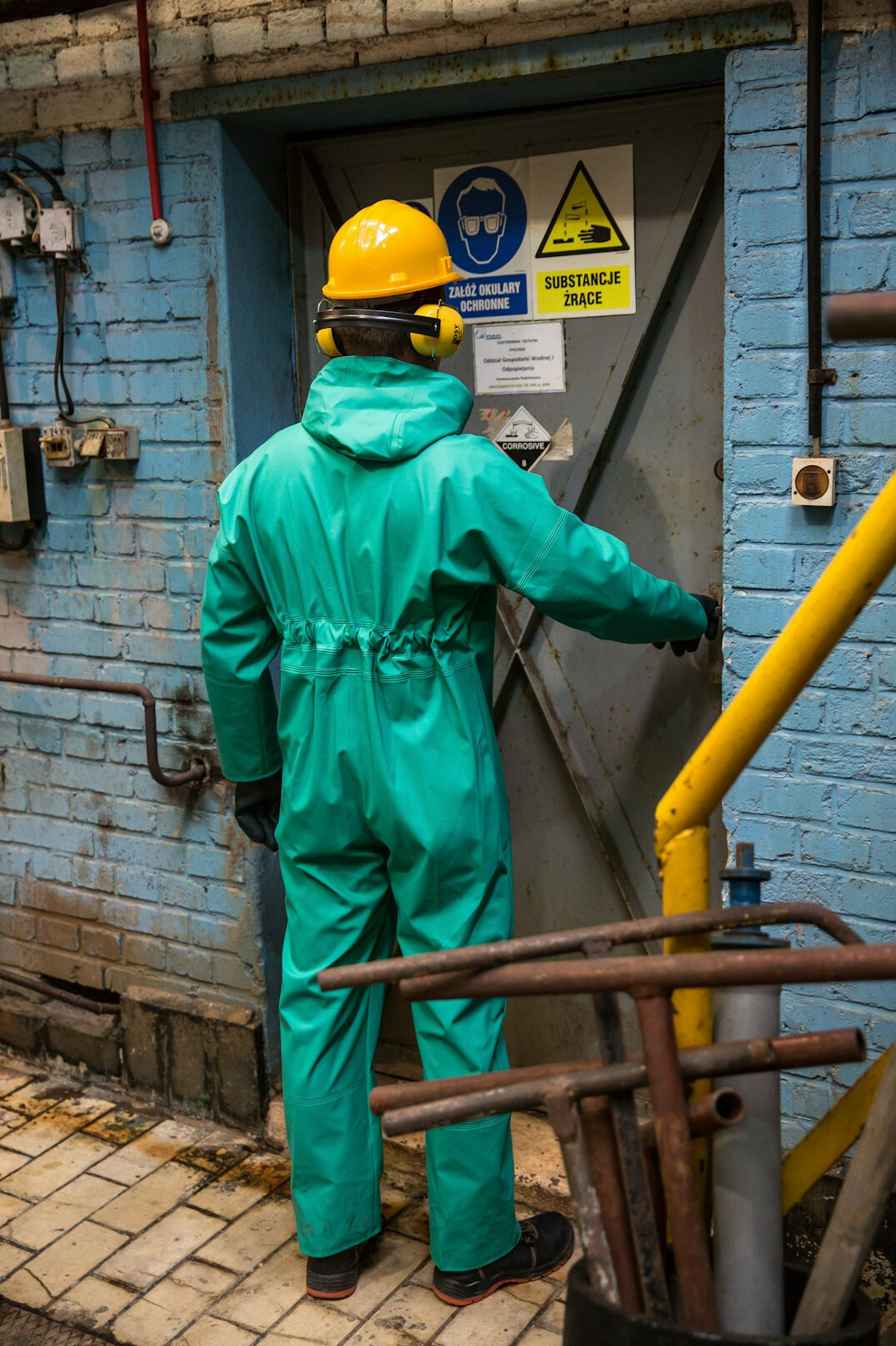 Portrait of a Polish factory worker in work overalls